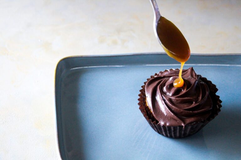 Chocolate cupcake with honey drizzled over it
